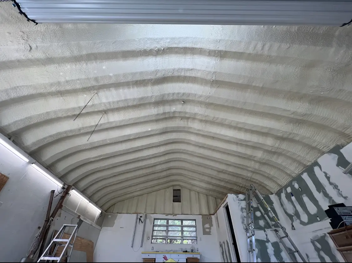 Spray polyurethane foam applied to the underside of a metal roof deck in Lyons